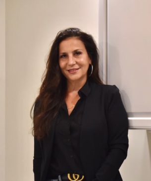 A Person Standing In Front Of A Mirror Posing For The Camera