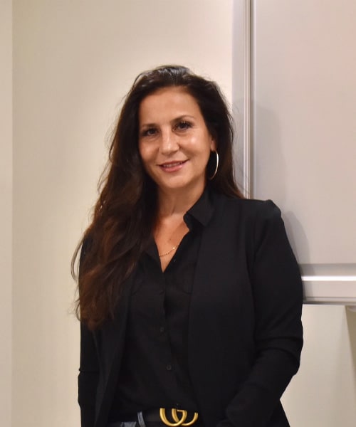 a person standing in front of a mirror posing for the camera